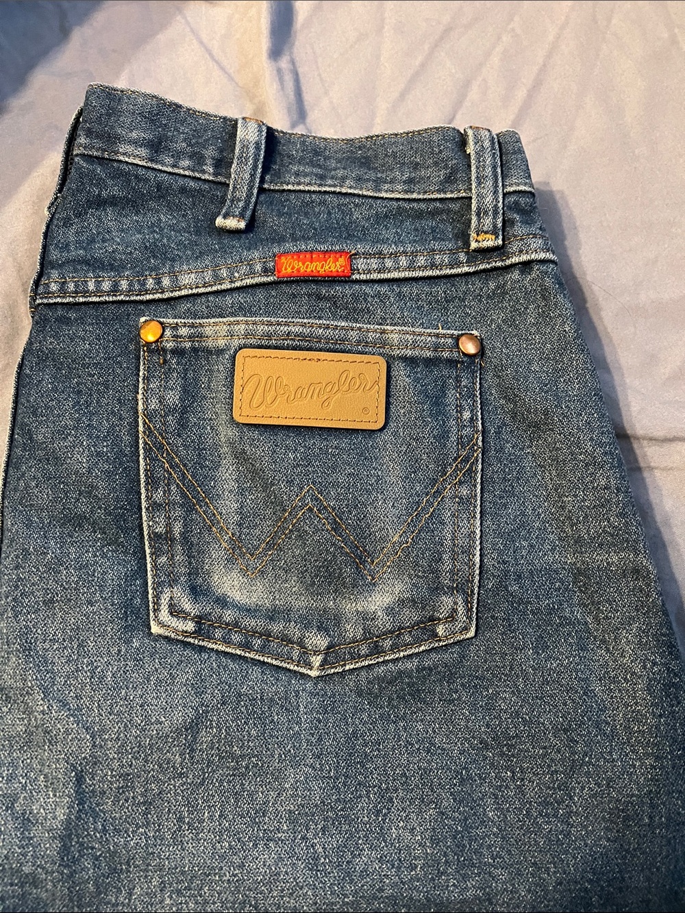Wrangler original cowboy cut slim fit women’s Denim Jeans in Blue with Tan Patch